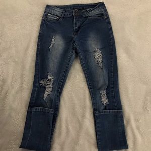 Distressed medium wash skinny jeans